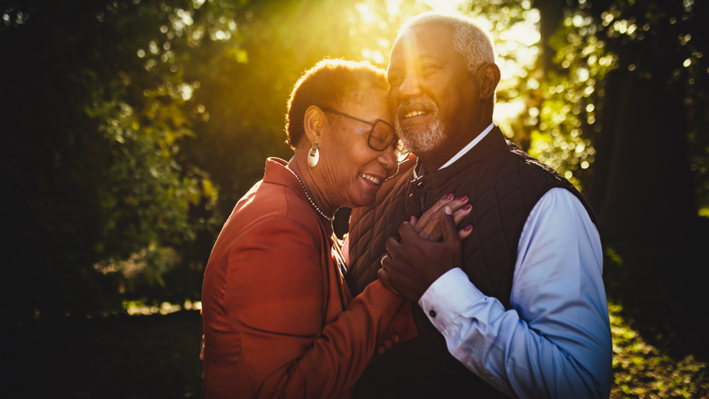 Old couple dancing outdoors as a dementia activity suitable at various stages