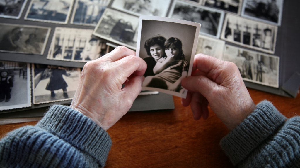 Looking at old photographs is a form of reminiscence therapy for people with dementia