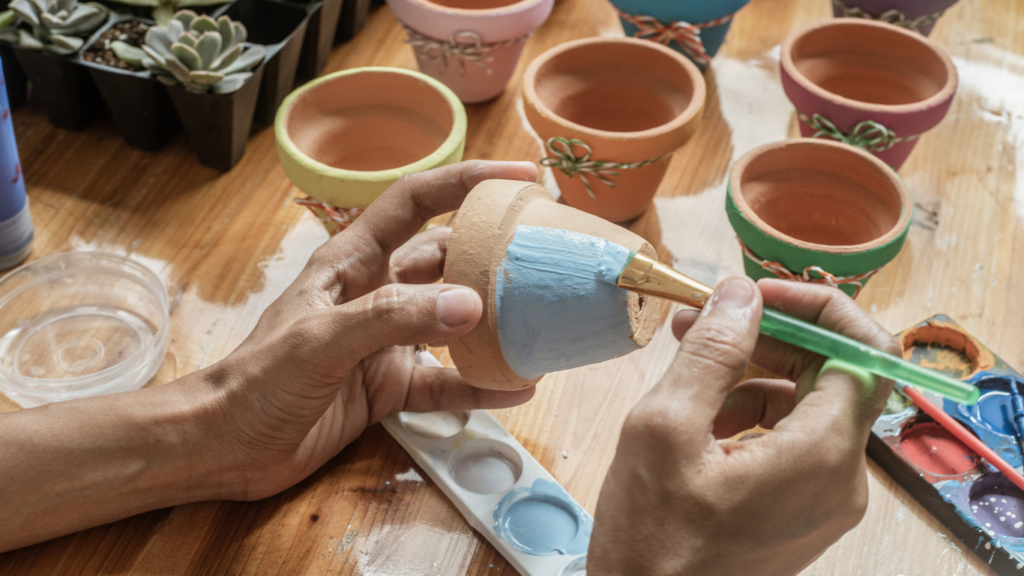 decorating plant pots is a great spring time activity for dementia